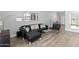 Living room features a sectional sofa and access to backyard at 6834 E 4Th St # 7, Scottsdale, AZ 85251