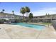 Community swimming pool with surrounding patio at 6834 E 4Th St # 7, Scottsdale, AZ 85251