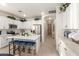 Modern kitchen with white cabinets, island, and stainless steel appliances at 7093 W Andrew Ln, Peoria, AZ 85383