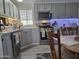 Updated kitchen featuring gray cabinets, stainless steel appliances, and a breakfast nook at 9302 E Broadway Rd # 184, Mesa, AZ 85208