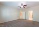 Bedroom with ceiling fan, carpeting, and access to bathroom at 955 E Knox Rd # 222, Chandler, AZ 85225