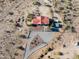 Aerial view showcasing a house, expansive lot, and desert surroundings at 1060 S Kellis Rd, Wickenburg, AZ 85390