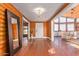 Entryway with wood floors, large mirror, and view to living area at 1060 S Kellis Rd, Wickenburg, AZ 85390