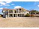 Two-story home with a large deck and a red tile roof at 1060 S Kellis Rd, Wickenburg, AZ 85390