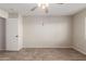 Well-lit bedroom featuring tile floors and a ceiling fan at 12322 W Larkspur Rd, El Mirage, AZ 85335