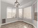 Bright breakfast nook featuring wood-look flooring and large windows at 12479 W Palm Ln, Avondale, AZ 85392