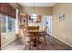 Bright dining room featuring a wood table and chairs, corner cabinet, and large window at 13155 W Monterey Way, Litchfield Park, AZ 85340