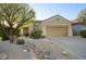 Single-story home with desert landscaping and two-car garage at 14430 N Agave Dr, Fountain Hills, AZ 85268