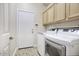 Laundry room with washer, dryer, and overhead cabinets at 14430 N Agave Dr, Fountain Hills, AZ 85268