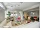 Open living room with sectional sofa, fireplace, and dining area at 14430 N Agave Dr, Fountain Hills, AZ 85268