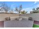 Outdoor patio with fire pit and seating area, perfect for entertaining at 21559 E Russet Rd, Queen Creek, AZ 85142