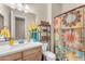 Clean bathroom with a shower/tub combo and modern vanity at 21559 E Russet Rd, Queen Creek, AZ 85142