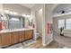 Elegant bathroom with double sinks and large mirror at 21559 E Russet Rd, Queen Creek, AZ 85142