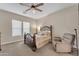 Spacious bedroom with ceiling fan and large windows at 21559 E Russet Rd, Queen Creek, AZ 85142