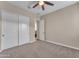 Well-lit bedroom with double door closet at 21559 E Russet Rd, Queen Creek, AZ 85142