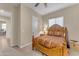 Bright bedroom with a wooden frame bed and an ensuite office at 21559 E Russet Rd, Queen Creek, AZ 85142