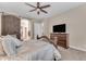 Comfortable bedroom with TV and built-in dresser at 21559 E Russet Rd, Queen Creek, AZ 85142