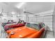 Spacious garage with three classic cars at 21559 E Russet Rd, Queen Creek, AZ 85142