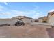View of garage and backyard with off-road vehicle at 21559 E Russet Rd, Queen Creek, AZ 85142