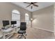 Home office with a desk, two monitors, and comfortable chair at 21559 E Russet Rd, Queen Creek, AZ 85142