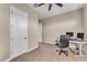 Spacious home office with built-in desk and neutral tones at 21559 E Russet Rd, Queen Creek, AZ 85142