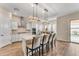 Modern kitchen with white cabinets, granite countertops, and an island at 21559 E Russet Rd, Queen Creek, AZ 85142