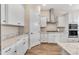 White kitchen cabinets and granite countertops with pantry at 21559 E Russet Rd, Queen Creek, AZ 85142