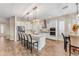 Modern kitchen with white cabinets, granite countertops, and stainless steel appliances at 21559 E Russet Rd, Queen Creek, AZ 85142