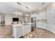 Large kitchen island with granite countertop and a double sink at 21559 E Russet Rd, Queen Creek, AZ 85142