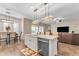 Kitchen with island, breakfast bar and adjacent dining area with table and chairs at 21559 E Russet Rd, Queen Creek, AZ 85142