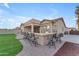 Backyard patio features a built-in bar with seating at 21559 E Russet Rd, Queen Creek, AZ 85142