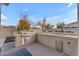 Outdoor kitchen with grill, sink, and bar seating at 21559 E Russet Rd, Queen Creek, AZ 85142