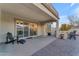 Outdoor patio with seating area and access to backyard at 21559 E Russet Rd, Queen Creek, AZ 85142