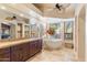 Elegant bathroom with soaking tub, double vanity, and tile flooring at 25255 N Ranch Gate Rd, Scottsdale, AZ 85255