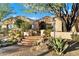 Beautiful home with a gated entry, stone steps, and desert landscaping at 25255 N Ranch Gate Rd, Scottsdale, AZ 85255