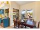 Bright kitchen with blue cabinets, granite counters, and view to backyard at 25255 N Ranch Gate Rd, Scottsdale, AZ 85255