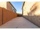 Private backyard access with gated entry and paved pathway at 371 E Santori Dr, San Tan Valley, AZ 85140