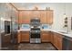 Modern kitchen with stainless steel appliances and light wood cabinets at 4049 E Roy Rogers Rd, Cave Creek, AZ 85331