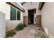 Front entry with stone accents and a paved walkway at 425 S 225Th Ave, Buckeye, AZ 85326