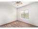 Bright bedroom featuring a window and ceiling fan at 44344 W Knauss Dr, Maricopa, AZ 85138