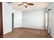 Spacious bedroom with ceiling fan and neutral wall colors at 44344 W Knauss Dr, Maricopa, AZ 85138