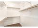 Large walk-in closet with ample shelving and hanging space at 44344 W Knauss Dr, Maricopa, AZ 85138
