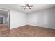 Spacious living room featuring tile floors and neutral walls at 44344 W Knauss Dr, Maricopa, AZ 85138