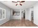 Bright living room with tile floors and kitchen view at 44344 W Knauss Dr, Maricopa, AZ 85138