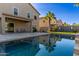 Stunning pool with reflection of home and lush landscaping at 44344 W Knauss Dr, Maricopa, AZ 85138