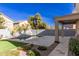 Inviting backyard pool with ample patio space at 44344 W Knauss Dr, Maricopa, AZ 85138