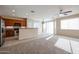 Kitchen with wood cabinets, island and sliding glass doors at 4831 W Dunbar Dr, Laveen, AZ 85339