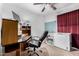 Home office features a desk, chair, and ample storage at 61 S 111Th Pl, Mesa, AZ 85208