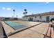 Outdoor shuffleboard court with benches and community building at 661 S Hawes Rd # 5, Mesa, AZ 85208