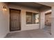 Front entry with a security door and a window at 821 E Bradstock Way, San Tan Valley, AZ 85140